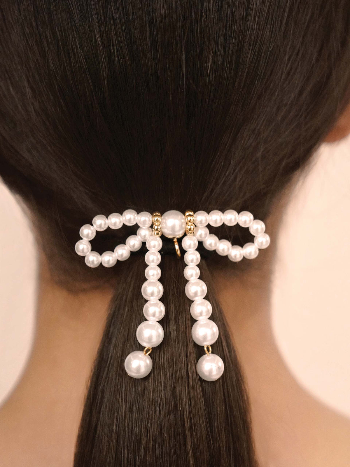 Aurora Pearl Bow Hair Tie - Gold Tone with Black Elastic | Ettika