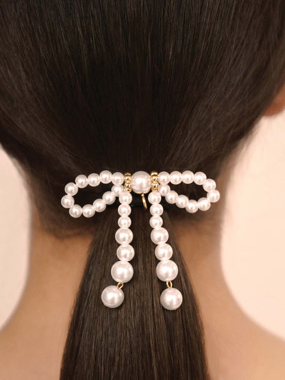 Aurora Pearl Bow Hair Tie - Gold Tone with Black Elastic | Ettika